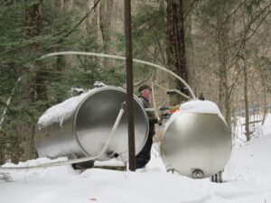 image of people and syrup machinery 