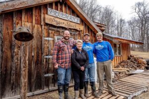 Image of Freeman family members outside of the Freeman Family Farm Sugar Shack