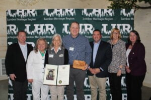 Jen & Chris McCracken accept Budding Partnership Award among state and local representatives