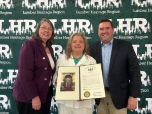 Holly Komonczi accepts LHR 25 Year Citation with Legislator representatives